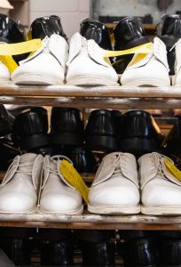 Shoes on shelves inside the cobbler shop