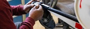 A cobbler repairing a midshipman's shoe