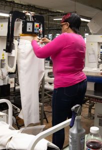 A worker in the laundry facility