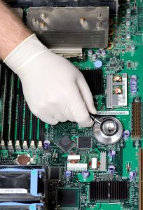 A technician repairing a computer