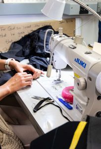 A worker using a sewing machine